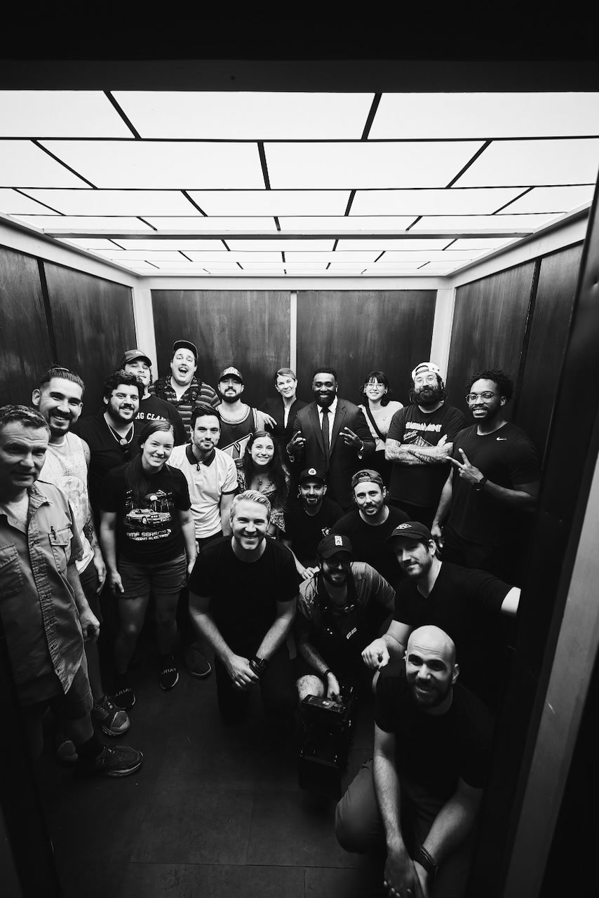The full OPEN DOOR cast and crew gathered in the elevator