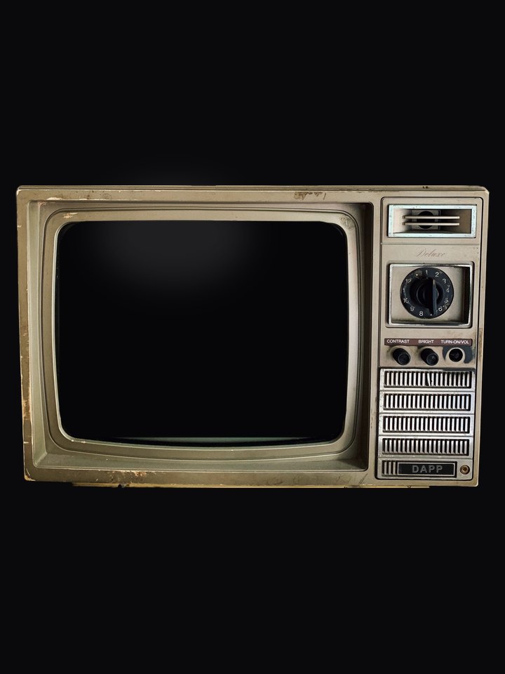 An old television, switched off, waiting to play the OPEN DOOR clue #2 video